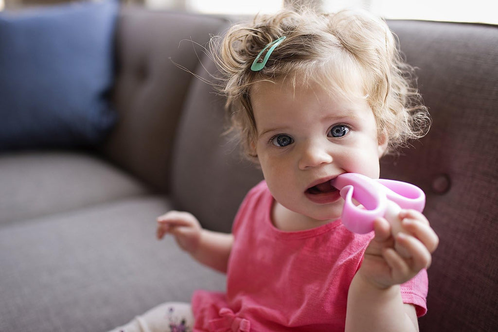 Baby Banana®Pink Teether-Toothbrush, Infant to Toddler, Made in USA, Butter-Soft Bristles for Gums and Teeth, Bendable Food Grade Silicone, Family-Owned Buisness since 2009, 11 Million+ Sold